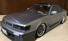 Gray Nissan Leopard scale model